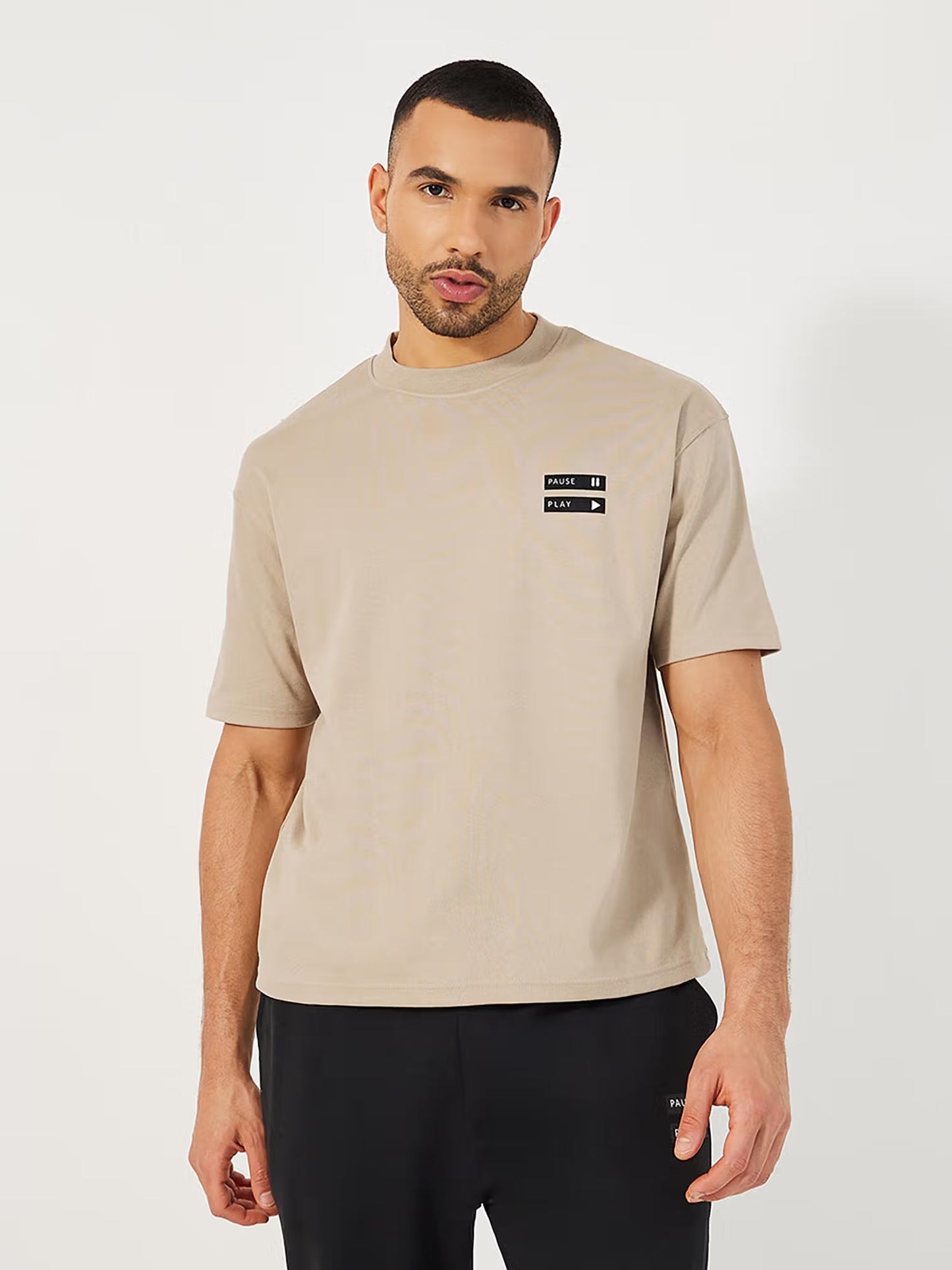 Styli Men Beige Minimal Graphic Mock Neck Oversized Co-ord Set
