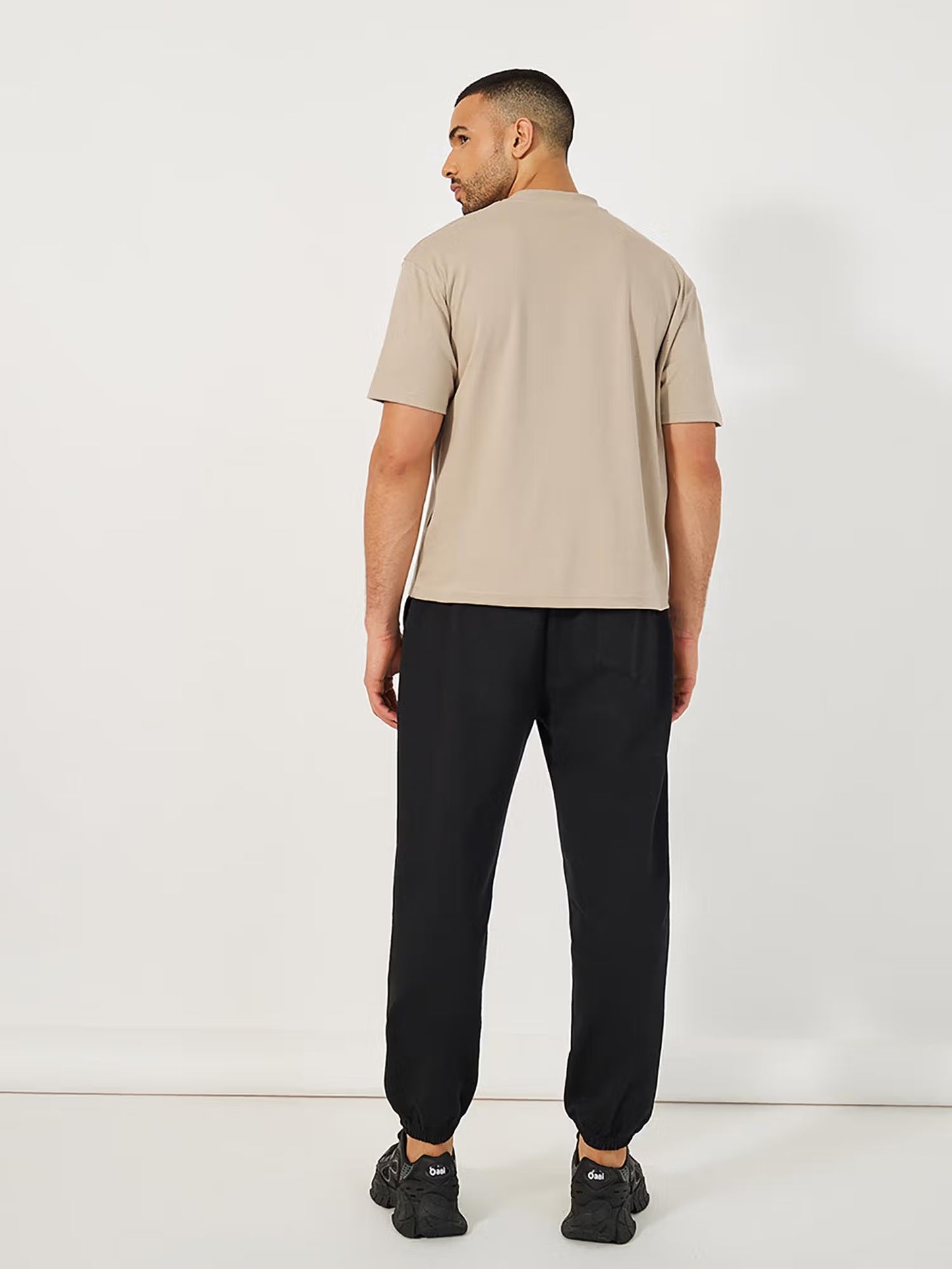 Styli Men Beige Minimal Graphic Mock Neck Oversized Co-ord Set